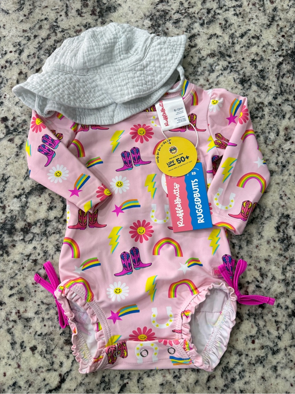 Ruffle Butts Pink UPF 50+ Rash Guard with Rainbows & Boots Print &white hat